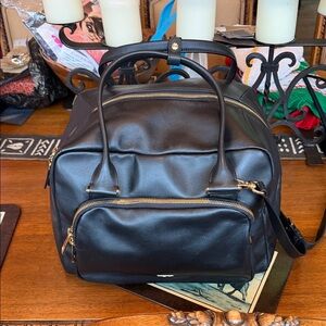Stunning “TUMI” NWT Leather Travel Bag